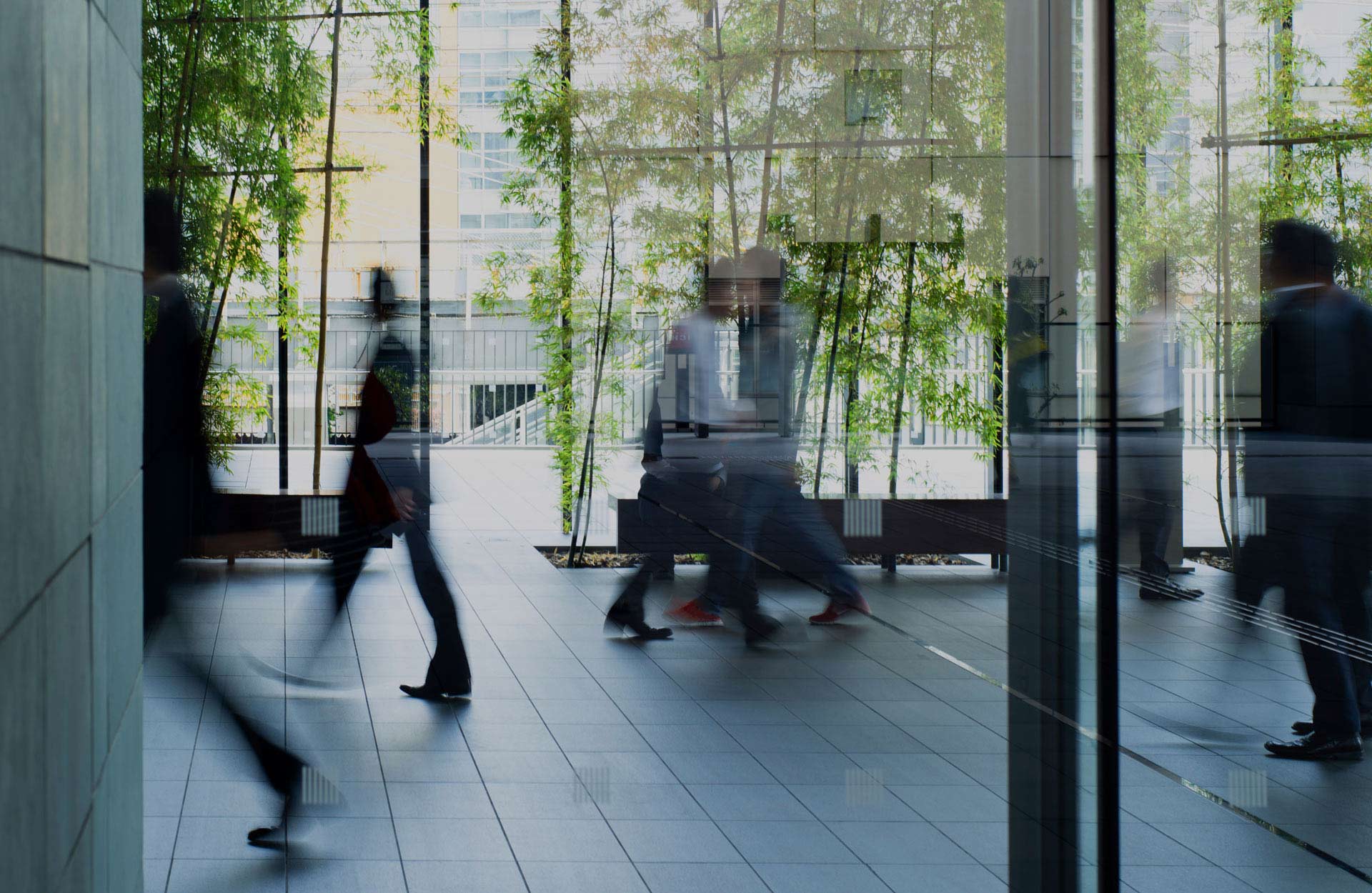 Blurred business professionals walking in a modern office